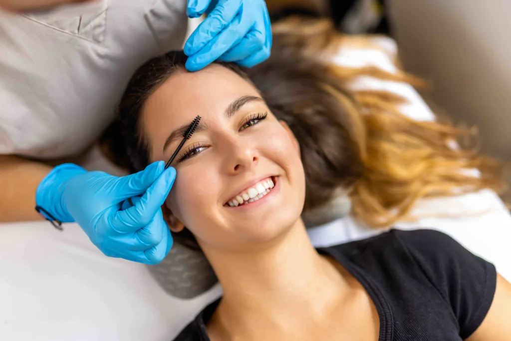 Young female client at Panache Hair Salon & Day Spa receiving a brow lamination and esthetics treatment package in Boise.