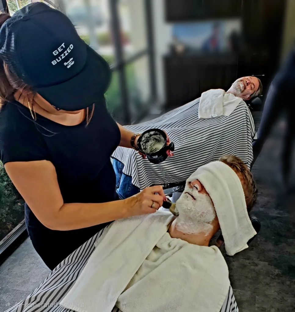 Clients of Panache Barbershop in Meridian, Idaho getting a straight razor shave and hot towel treatment as a Father's Day gift from their family.