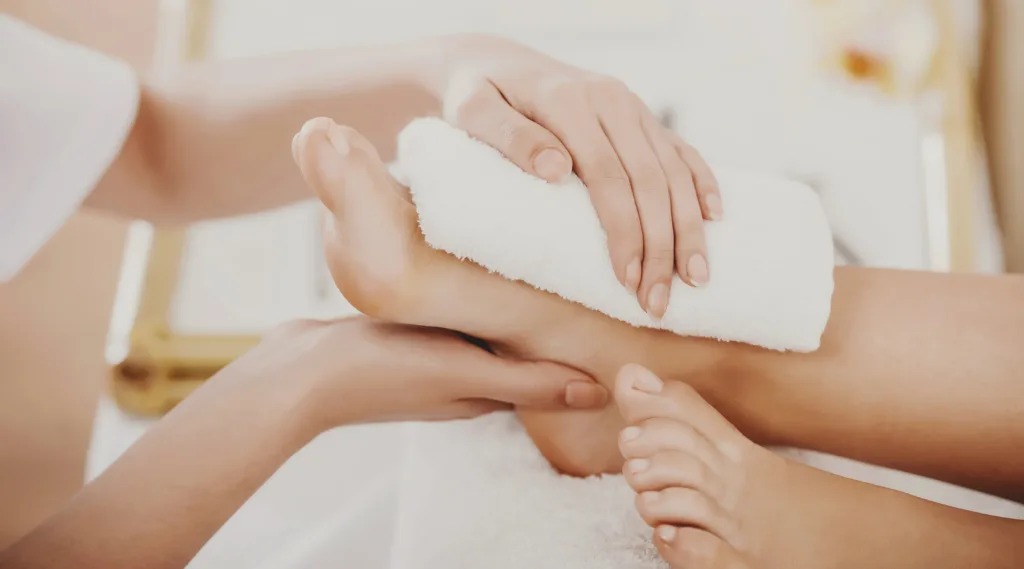 A person's feet getting pampered with a spa pedicure at Panache in Meridian, Idaho. Warm water foot massage, cuticle care, removes dead skin cells, soften the skin, trim and shape toenails, creating healthy feet in Idaho's dry Autumn weather. 